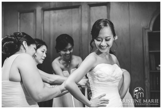 Bridesmaids helping bride get ready photo | San Diego Botanic Wedding Pictures | Kristine Marie Photography