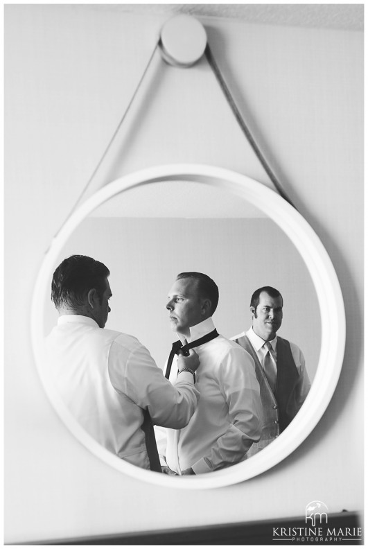 Groomsmen Putting Tie On | Mirror | Hyatt Regency Wedding Photographer | San Diego Wedding and Portrait Photographer | Photo by: Kristine Marie Photography