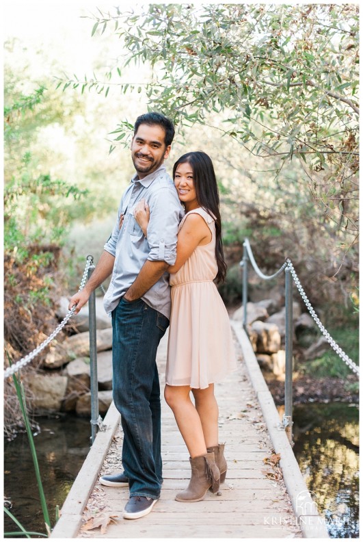 Couple Posing on the Bridge | San Diego Engagement Photographer | Kristine Marie Photography