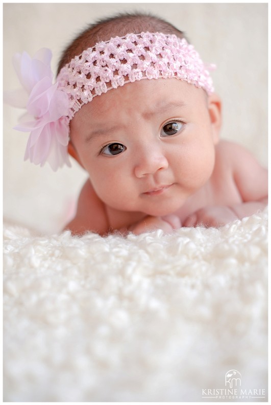 Up Close Photo of Baby Girl in Pink Headband | San Diego Newborn Baby Photographer | Kristine Marie Photography