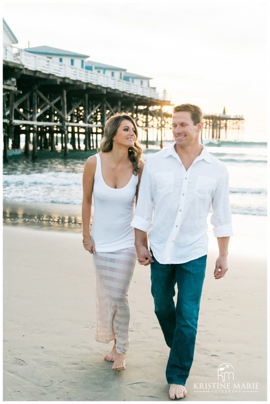 Engaged Couple Walking on the Beach | San Diego Engagement Photographer | © Kristine Marie Photography