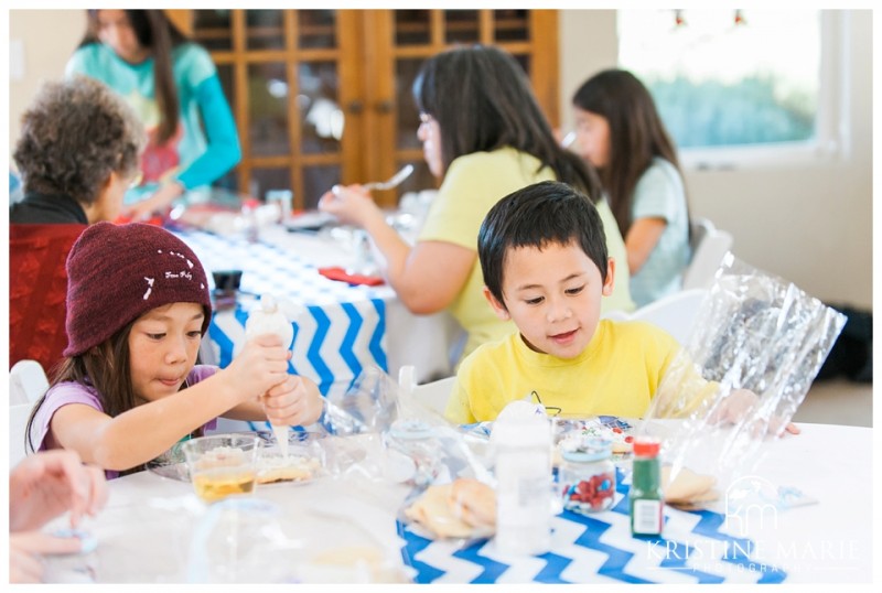 Kids decorate cookeis | First Birthday Party Photo | Dr. Seuss Theme | San Diego Event Photographer | Kristine Marie Photography  | © www.kristinemariephotography.com