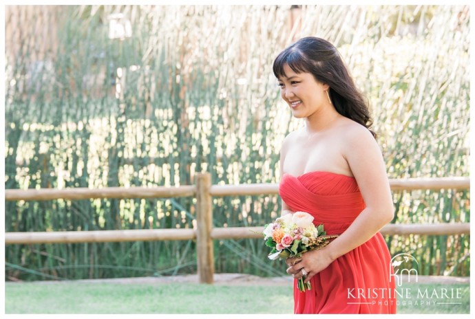 Bridesmaid in Coral | Temecula Creek Inn Wedding Photo | Temecula Wedding Photographer | Kristine Marie Photography | © www.kristinemariephotography.com