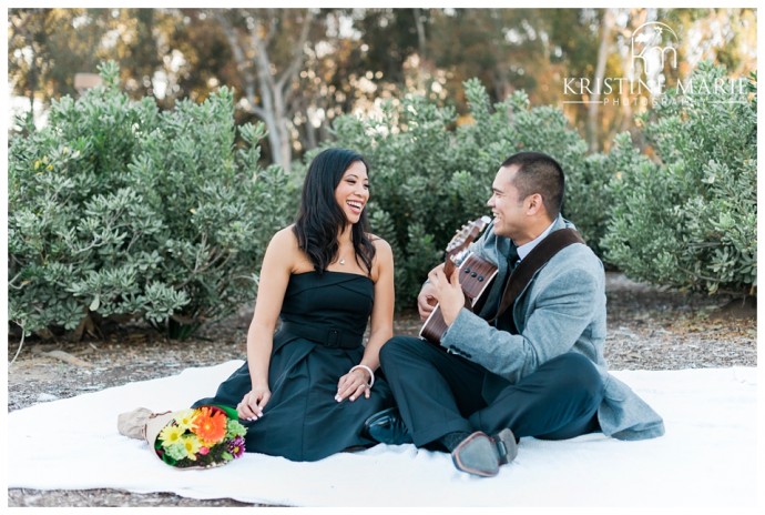 happy couple picnic and guitar | UCSD Engagement Photo | La Jolla Engagement Wedding Photographer | © www.kristinemariephotography.com