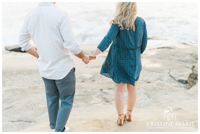 Cute couple holding hands  Windandsea Beach Engagement Photo | La Jolla Wedding Photographer | Kristine Marie Photography | © www.kristinemariephotography.com