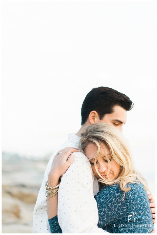 Couple Embracing  Windandsea Beach Engagement Photo | La Jolla Wedding Photographer | Kristine Marie Photography | © www.kristinemariephotography.com