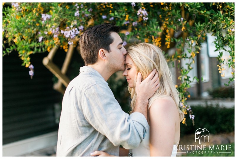 Forehead Kiss Under Wisteria  | La Jolla Engagement Photographer | Kristine Marie Photography | © www.kristinemariephotography.com