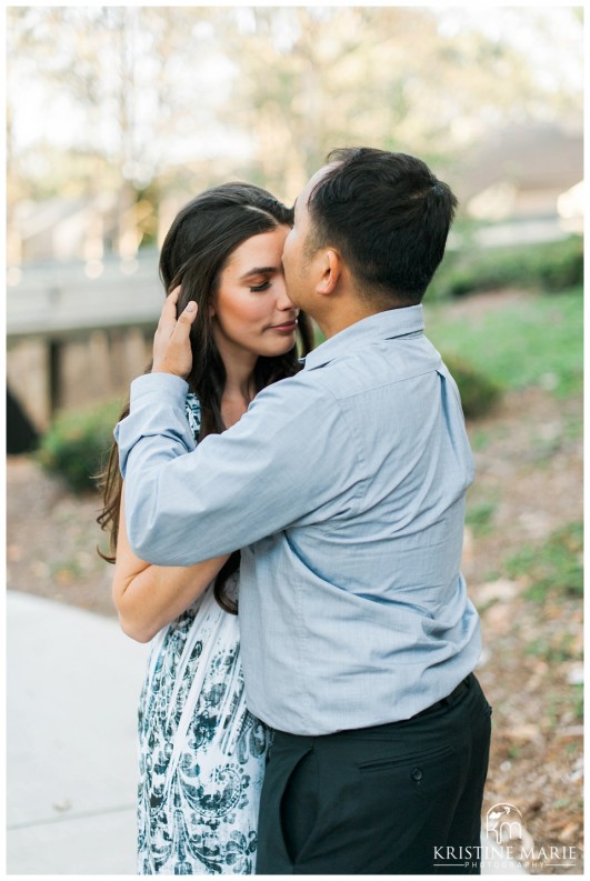 Romantic couple kissing in park | Westfield UTC Mall Photos | La Jolla Engagement Photographer | Kristine Marie Photography © www.kristinemariephotography.com