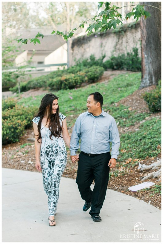 Romantic couple walking in park | Westfield UTC Mall Photos | La Jolla Engagement Photographer | Kristine Marie Photography © www.kristinemariephotography.com