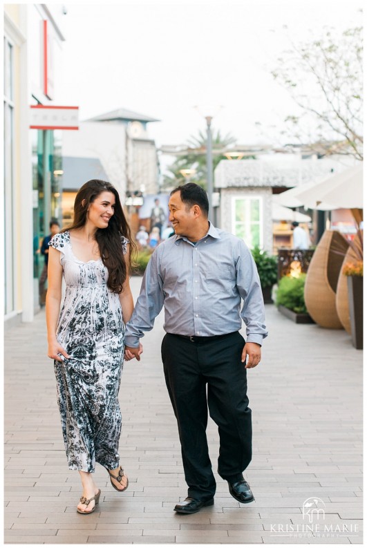 Happy Couple holding hands walking | Westfield UTC Mall Photos | La Jolla Engagement Photographer | Kristine Marie Photography © www.kristinemariephotography.com