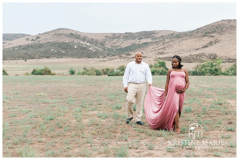 Husband Holding the back of wife's dress |  Poway San Diego Maternity Photographer | Kristine Marie Photography © www.kristinemariephotography.com