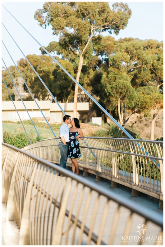 Couple Kissing on Bridge | Scripps Pier Beach Engagement Photo | San Diego Engagement Photographer | Kristine Marie Photography © www.kristinemariephotography.com (15)