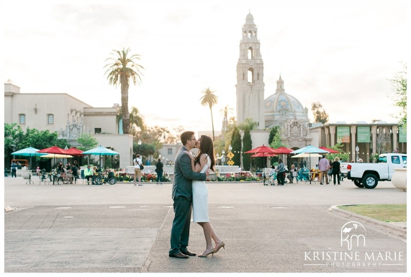 Engaged couple kissing | Balboa Park Engagement Photo | © Kristine Marie Photography | www.kristinemariephotography.com