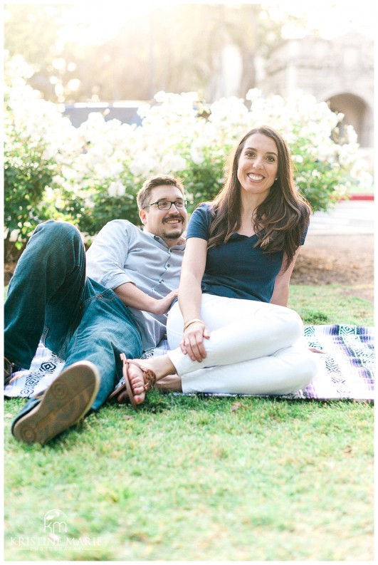 Cute couple picnic at Balboa Park | Balboa Park Engagement Photo | © Kristine Marie Photography | www.kristinemariephotography.com