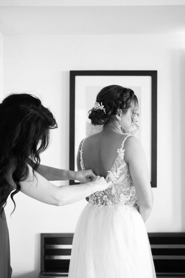 San Diego wedding photographer | Bride's dress getting buttoned