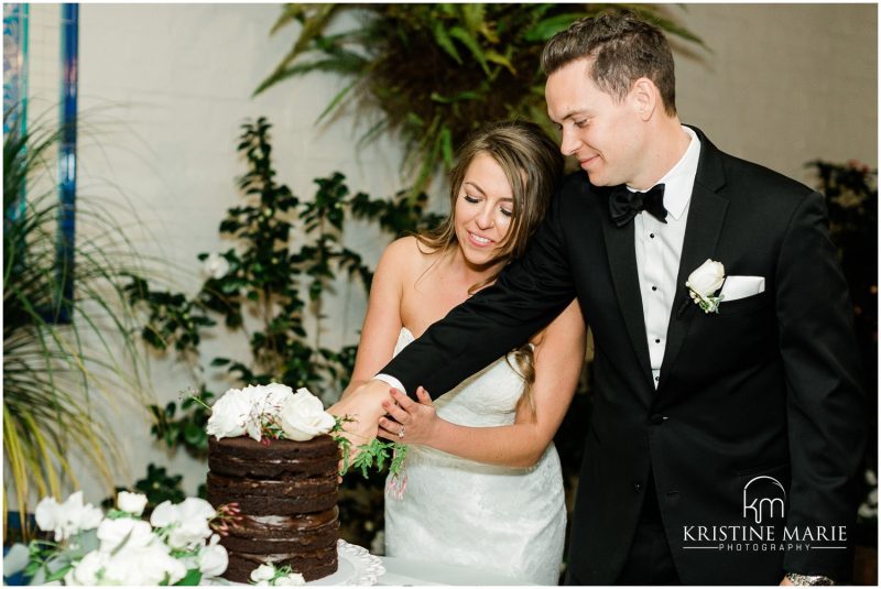 cake cutting chocolate Darlington House La Jolla Wedding Photo | © Kristine Marie Photography (67)