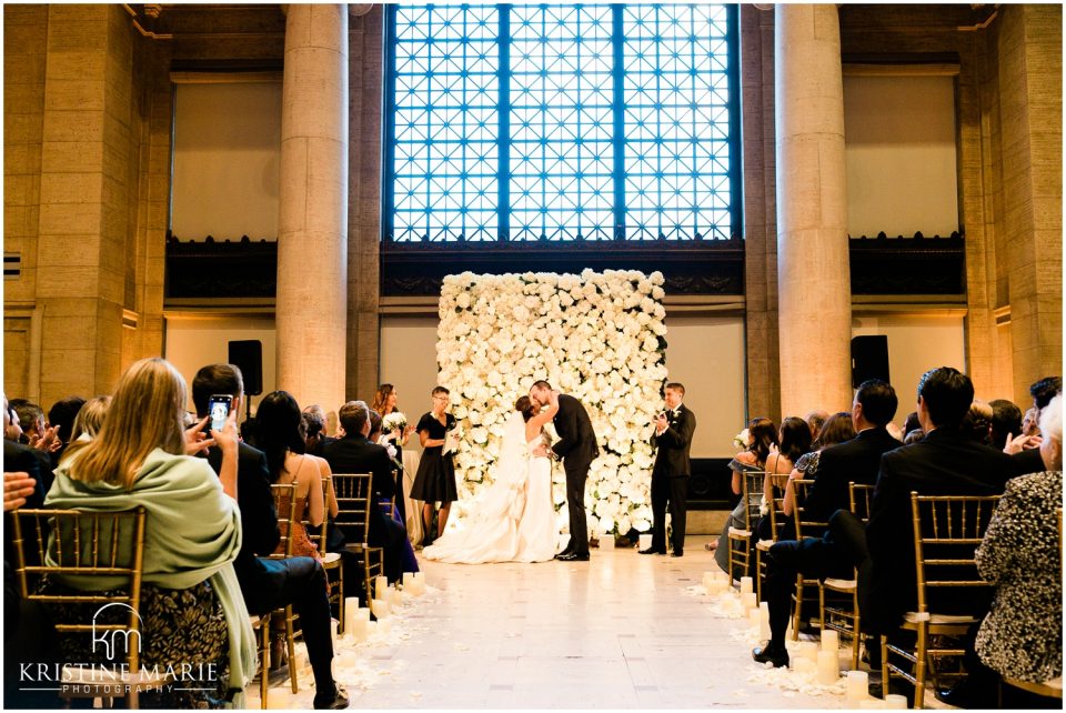 first kiss ceremony flower wall photo | Asian Art Museum San Francisco Wedding Photographer | © Kristine Marie Photography 