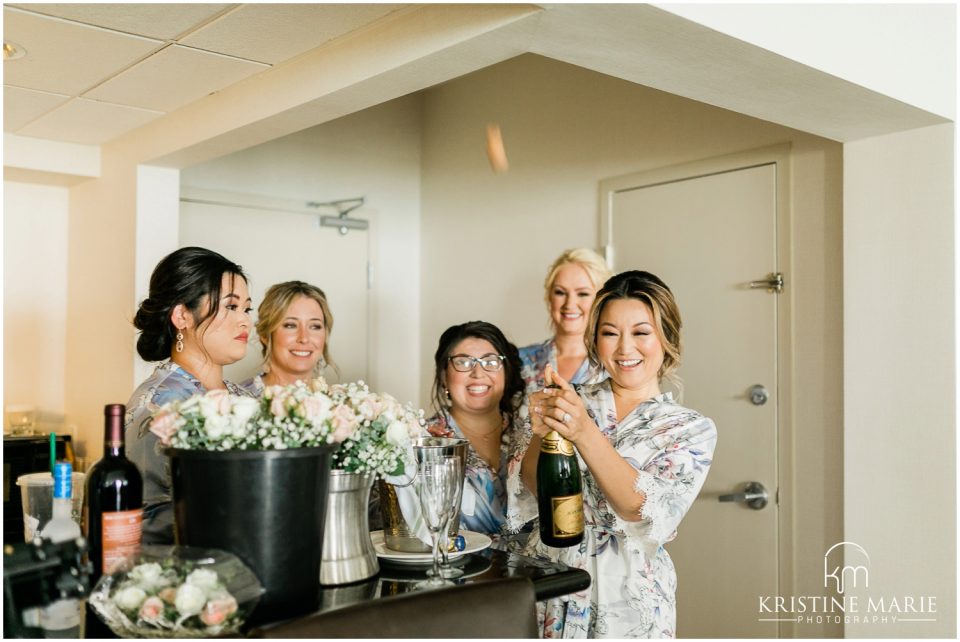 Hilton Harbor Island bride and bridesmaids pop champagne | Tom Ham's Lighthouse San Diego Wedding Photo | © Kristine Marie Photography (57)