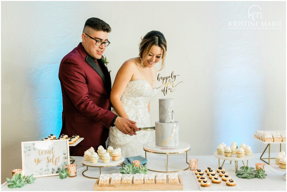 bride groom cake cutting marble cake | Tom Ham's Lighthouse San Diego Wedding Photo | © Kristine Marie Photography (12)