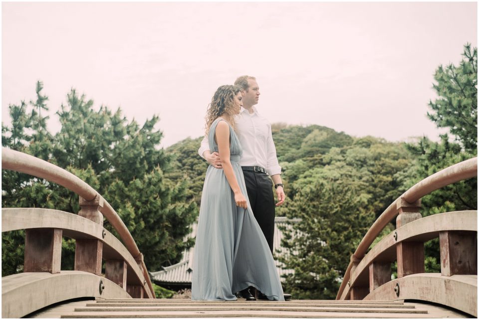 Couple on red bridge | Yokosuka Tokyo Family Couples Photographer | © Kristine Marie Photography 