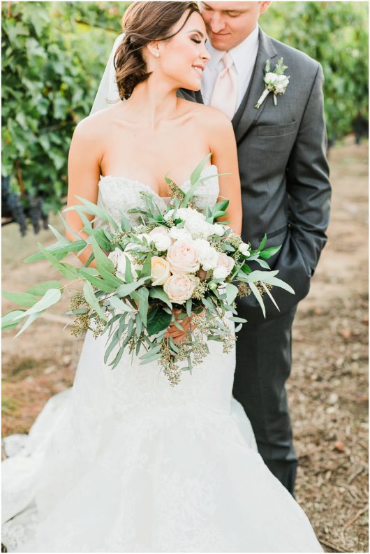 beautiful organic wedding bouquet bride and groom photo | Temecula Ponte Winery Wedding Photographer | Kristine Marie Photography