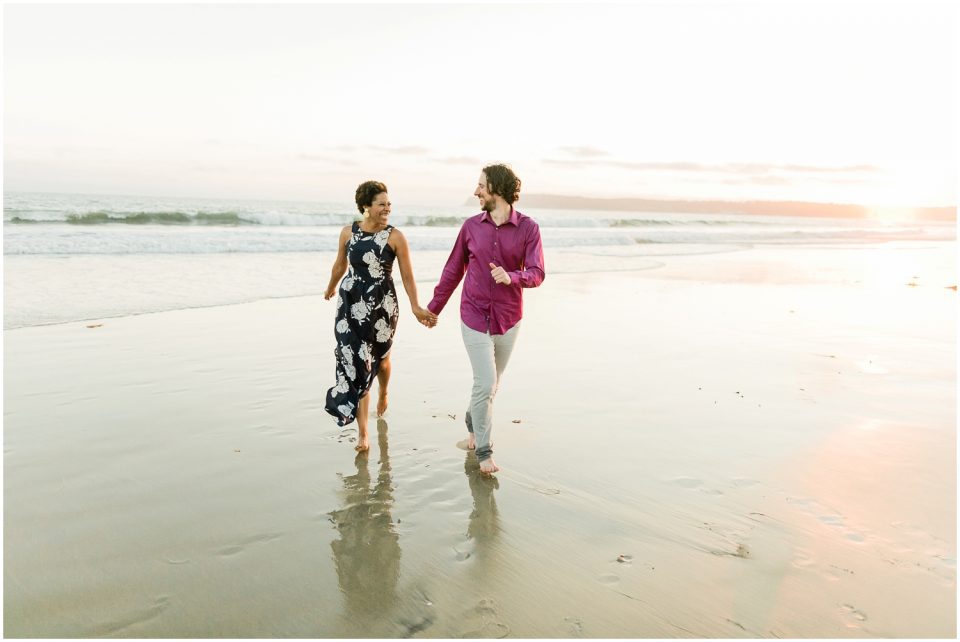 couple running holding hands Hotel Del coronado Beach Engagement Pictures San Diego Engagement Photographer Kristine Marie Photography