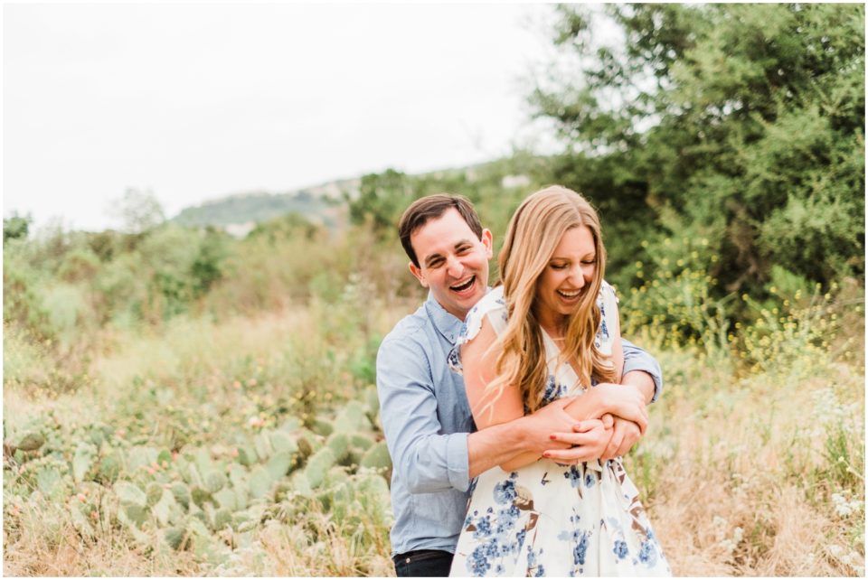 happy couple hugging Los Penasquitos Canyon Preserve Engagement Pictures | San Diego Engagement Photographer © Kristine Marie Photography