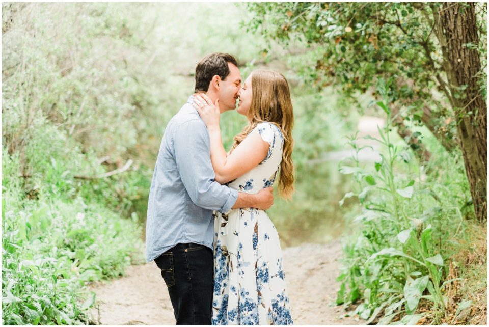 engaged couple kissing by creek Los Penasquitos Canyon Preserve Engagement Pictures | San Diego Engagement Photographer © Kristine Marie Photography