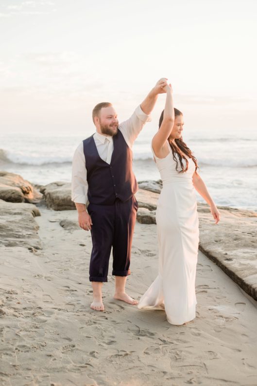 Bride and groom dancing on beach photo | San Diego Elopement Photographer © Kristine Marie Photography