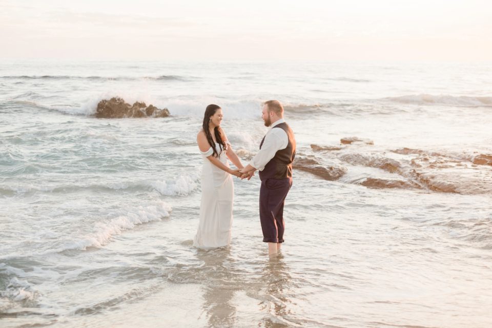 Couple playing in waves photo | San Diego Elopement Photographer © Kristine Marie Photography