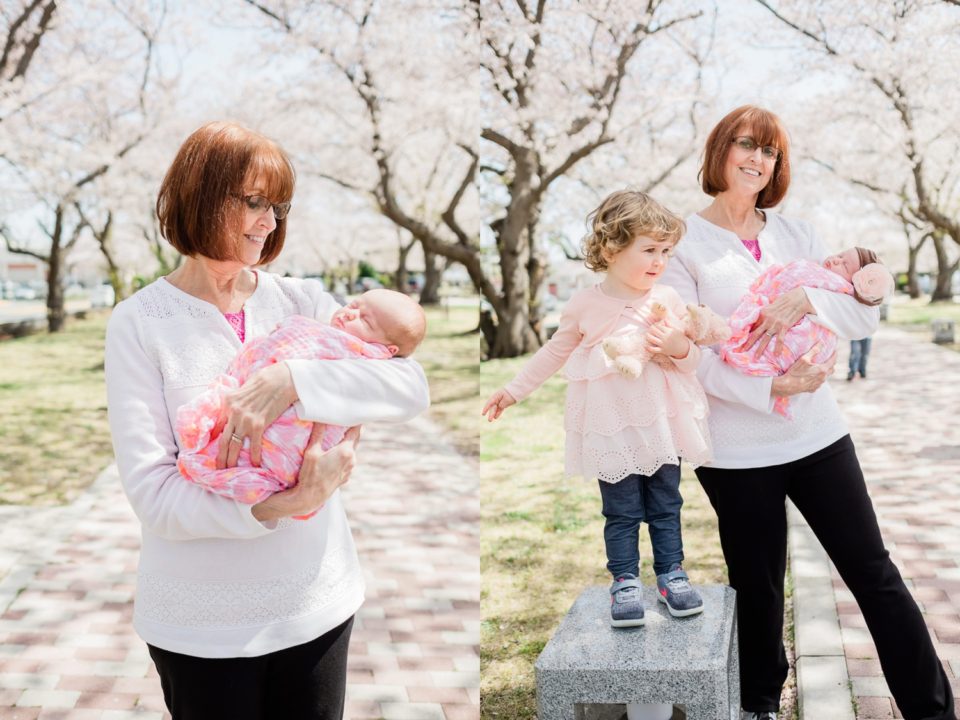 Happy grandmother holding newborn grandaughter | San Diego family photographer | © Kristine Marie Photography