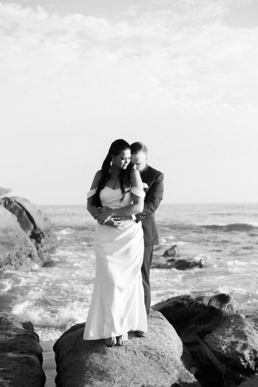 black and white photo bride and groom on rocks San Diego Wedding Photographer © Kristine Marie Photography