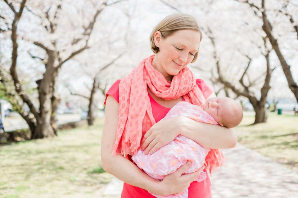 Mother holding newborn baby | San Diego family photographer | © Kristine Marie Photography