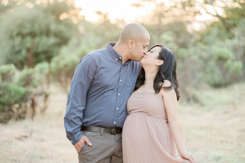 husband kissing pregnant wife Los Penasquitos Canyon Preserve San Diego Maternity Photographer | © Kristine Marie Photography