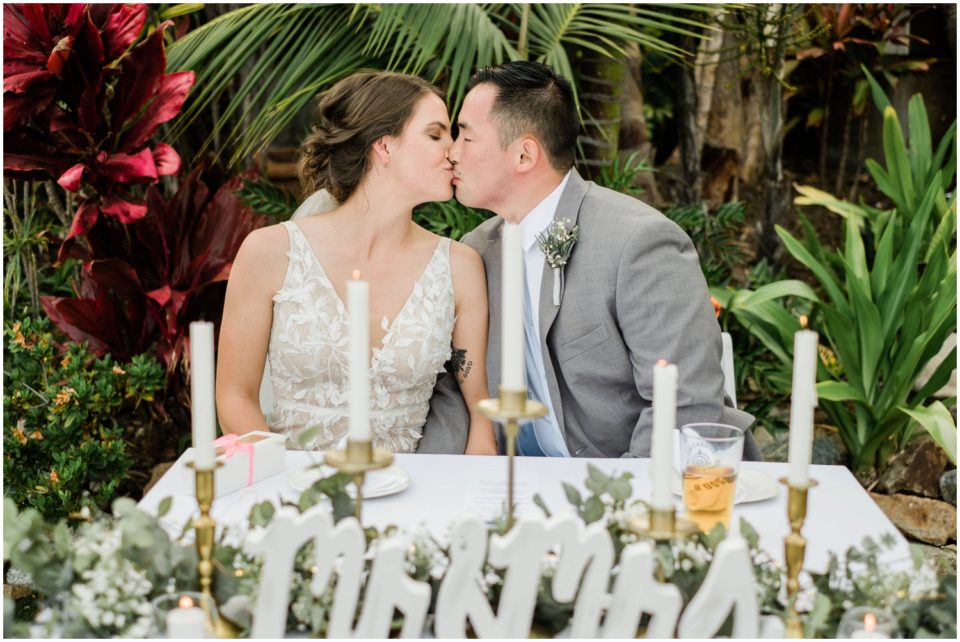 Bride and Groom Kissing at Sweetheart Table Picture | Brigantine Del Mar Wedding Photographer | © Kristine Marie Photography