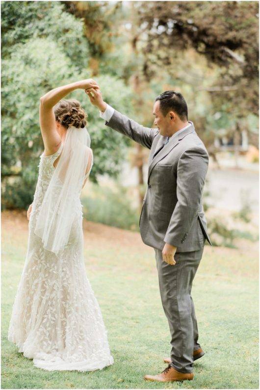 Groom Twirling Bride During First Look | Carlsbad Wedding Photographer | © Kristine Marie Photography