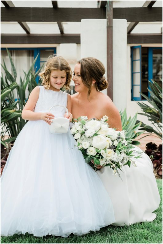 flower girl with bride photo | Ole Hanson Beach Club San Clemente Wedding Photographer | © Kristine Marie Photography