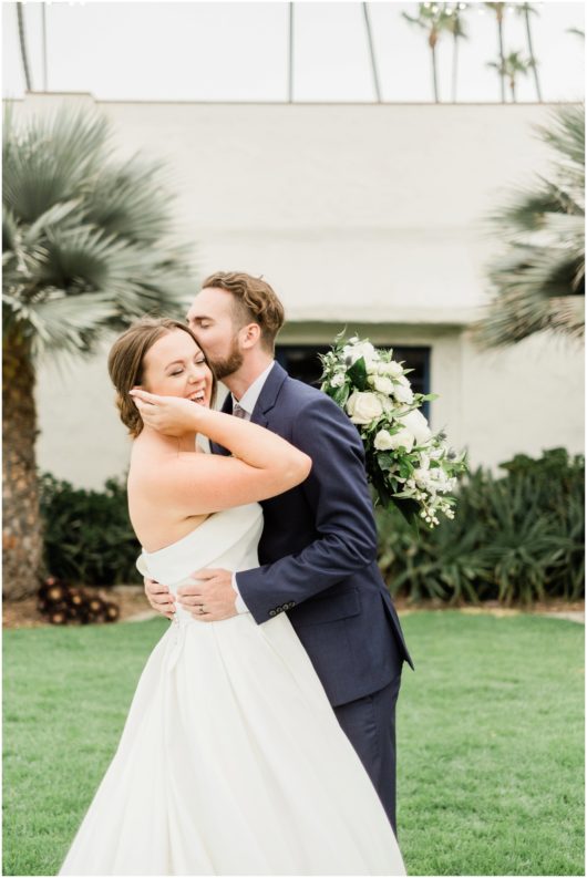 happy bride and groom laughing photo | Ole Hanson Beach Club San Clemente Wedding Photographer | © Kristine Marie Photography