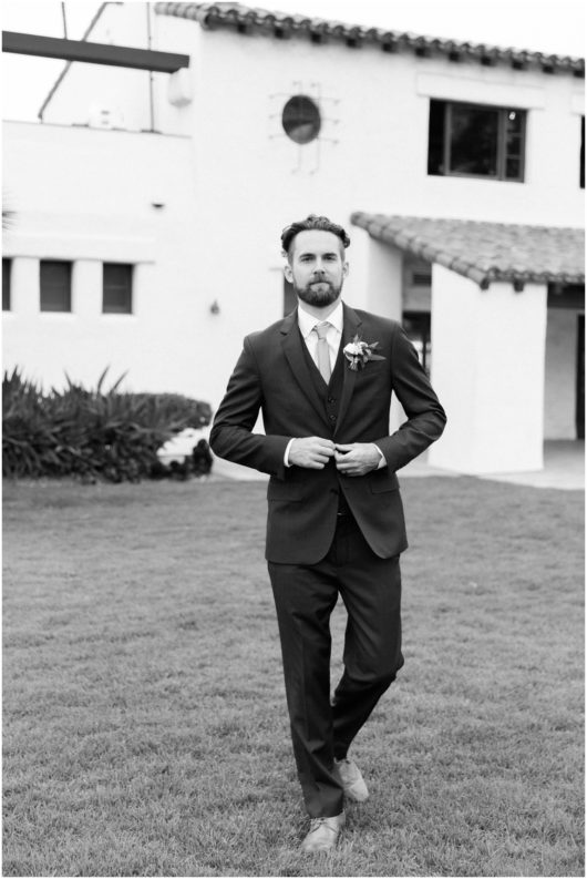 groom in suit black and white photo photo | Ole Hanson Beach Club San Clemente Wedding Photographer | © Kristine Marie Photography