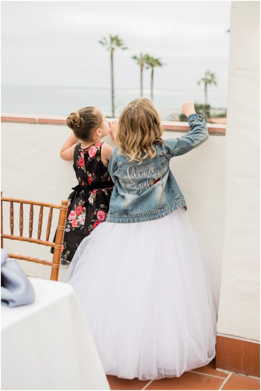 flower girls denim jacket photo | Ole Hanson Beach Club San Clemente Wedding Photographer | © Kristine Marie Photography