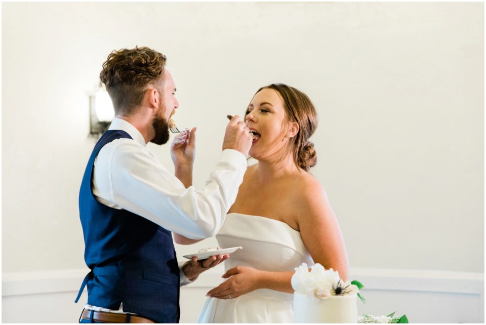 bride and groom feed each other cake photo | Ole Hanson Beach Club San Clemente Wedding Photographer | © Kristine Marie Photography