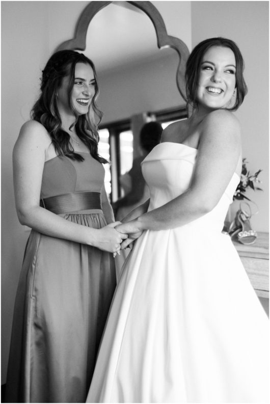 bride and maid of honor getting ready photo | Ole Hanson Beach Club San Clemente Wedding Photographer | © Kristine Marie Photography