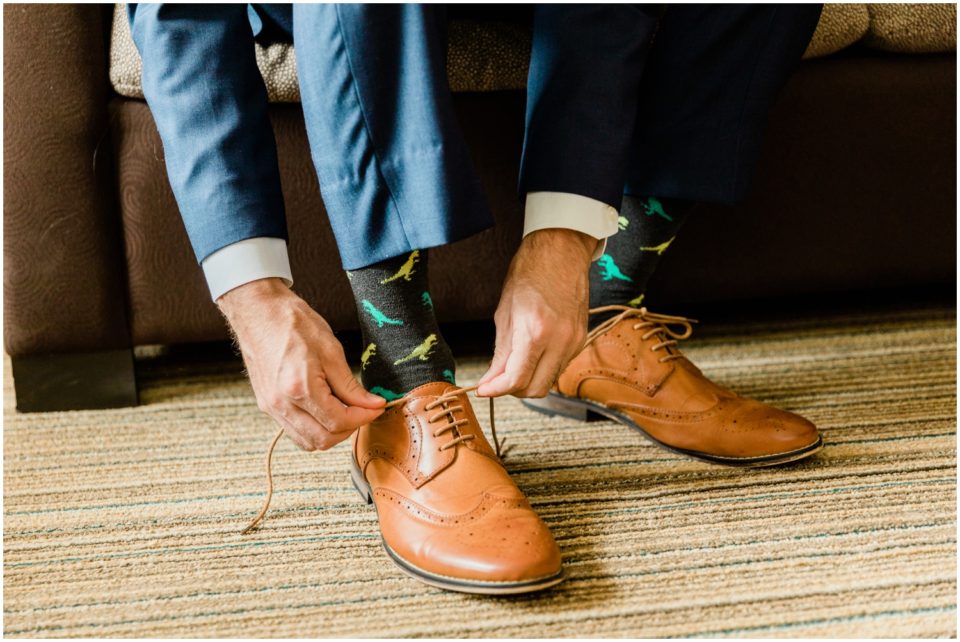 groom with cool socks wedding shoes photo | Ole Hanson Beach Club San Clemente Wedding Photographer | © Kristine Marie Photography